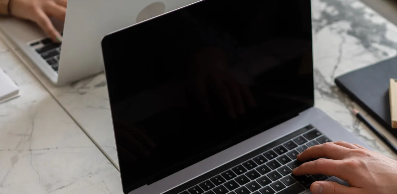 Business owner reviewing their Google Business Profile on a laptop during a free local SEO audit