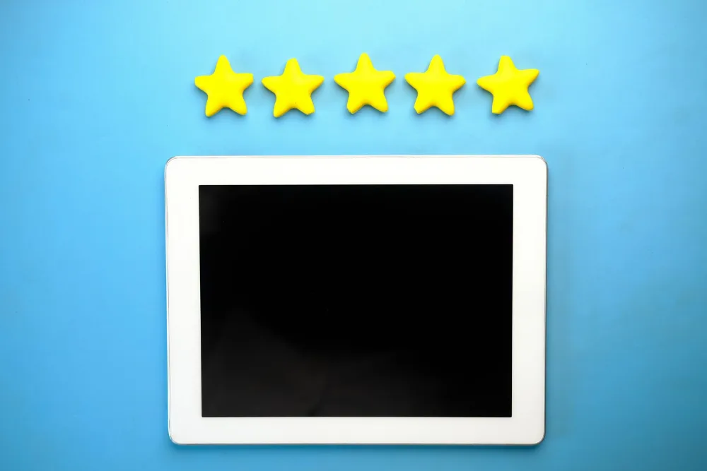 Tablet screen displaying a five-star customer review rating for a local business