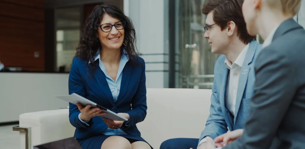 Business owner meeting with an SEO consultant to compare hiring a consultant versus an agency