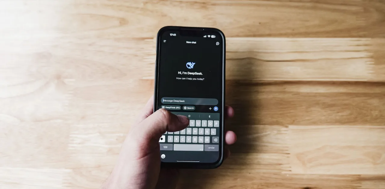Person asking an AI assistant a question on a smartphone